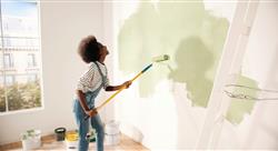 woman painting room green